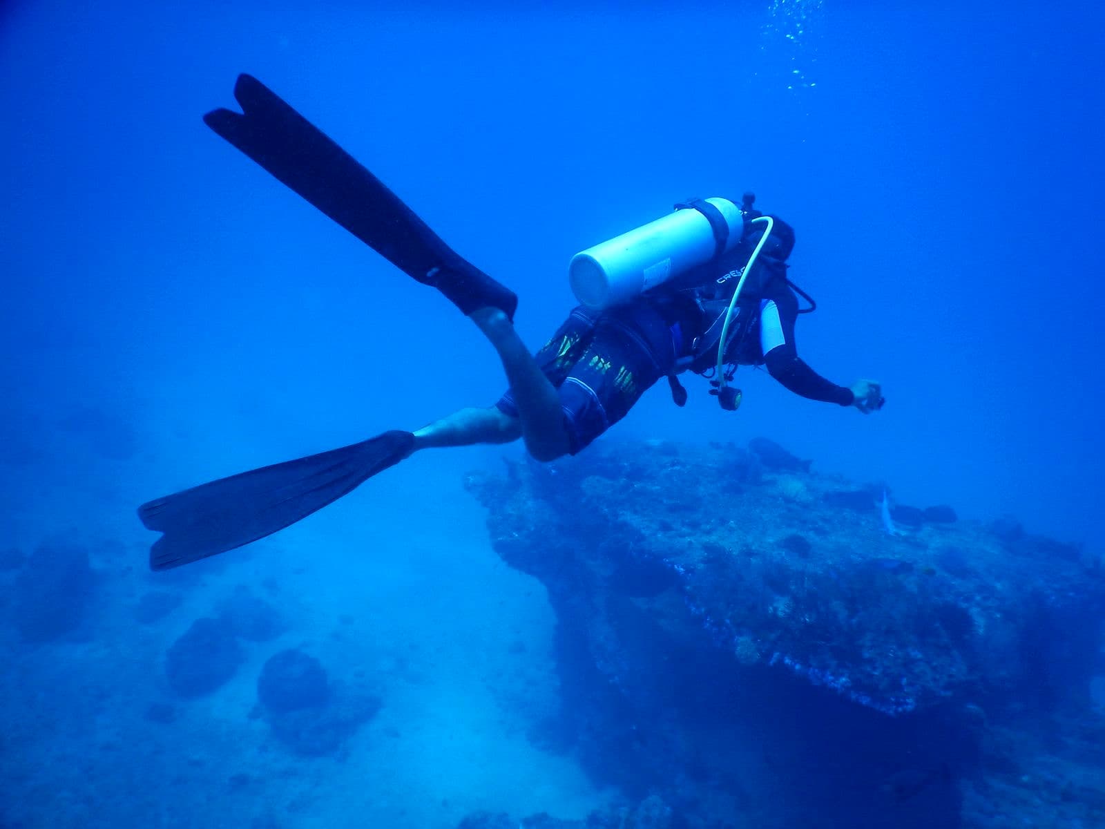 A diver exploring underwater depths, generic/atmospheric