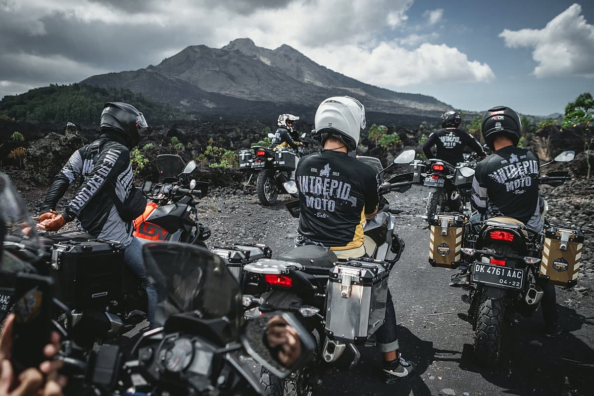 Motorcycle riders with Mount Batur behind them at Kintamani